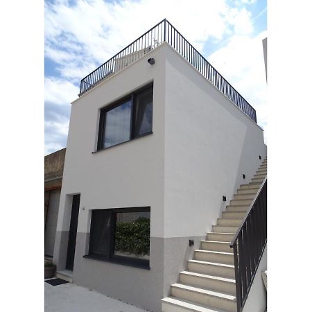 Modern Small House With A Terrace Split Exterior photo