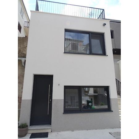 Modern Small House With A Terrace Split Exterior photo