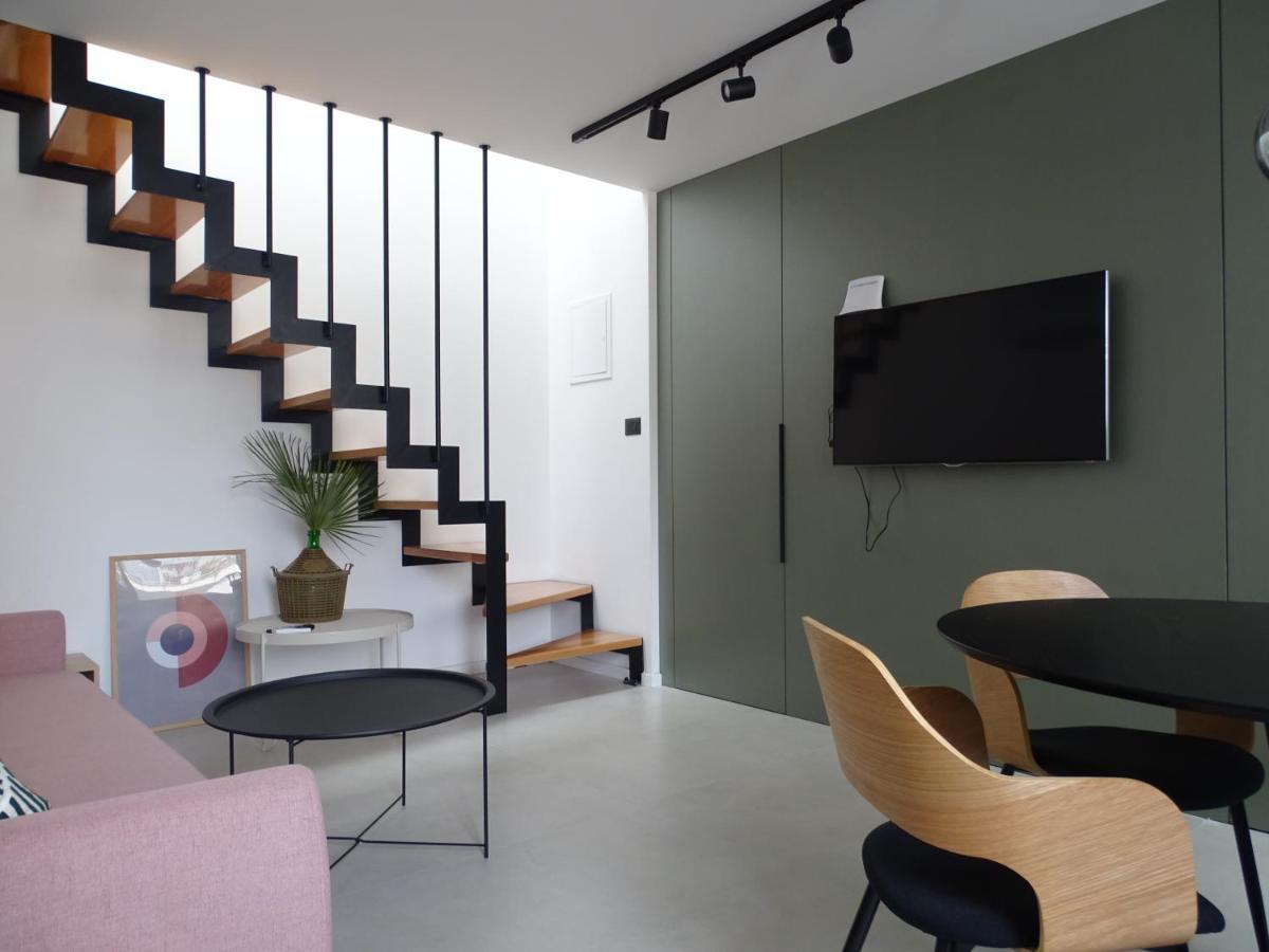 Modern Small House With A Terrace Split Exterior photo